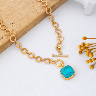 Turquoise-Tone Medallion Toggle Necklace-Necklace-JOSSLYN by wall to wall-80N93042-The Twisted Chandelier