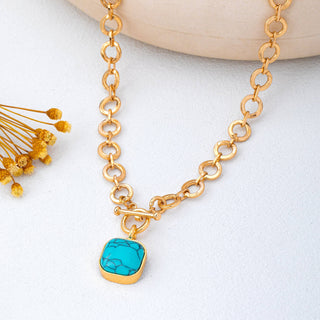 Turquoise-Tone Medallion Toggle Necklace-Necklace-JOSSLYN by wall to wall-80N93042-The Twisted Chandelier
